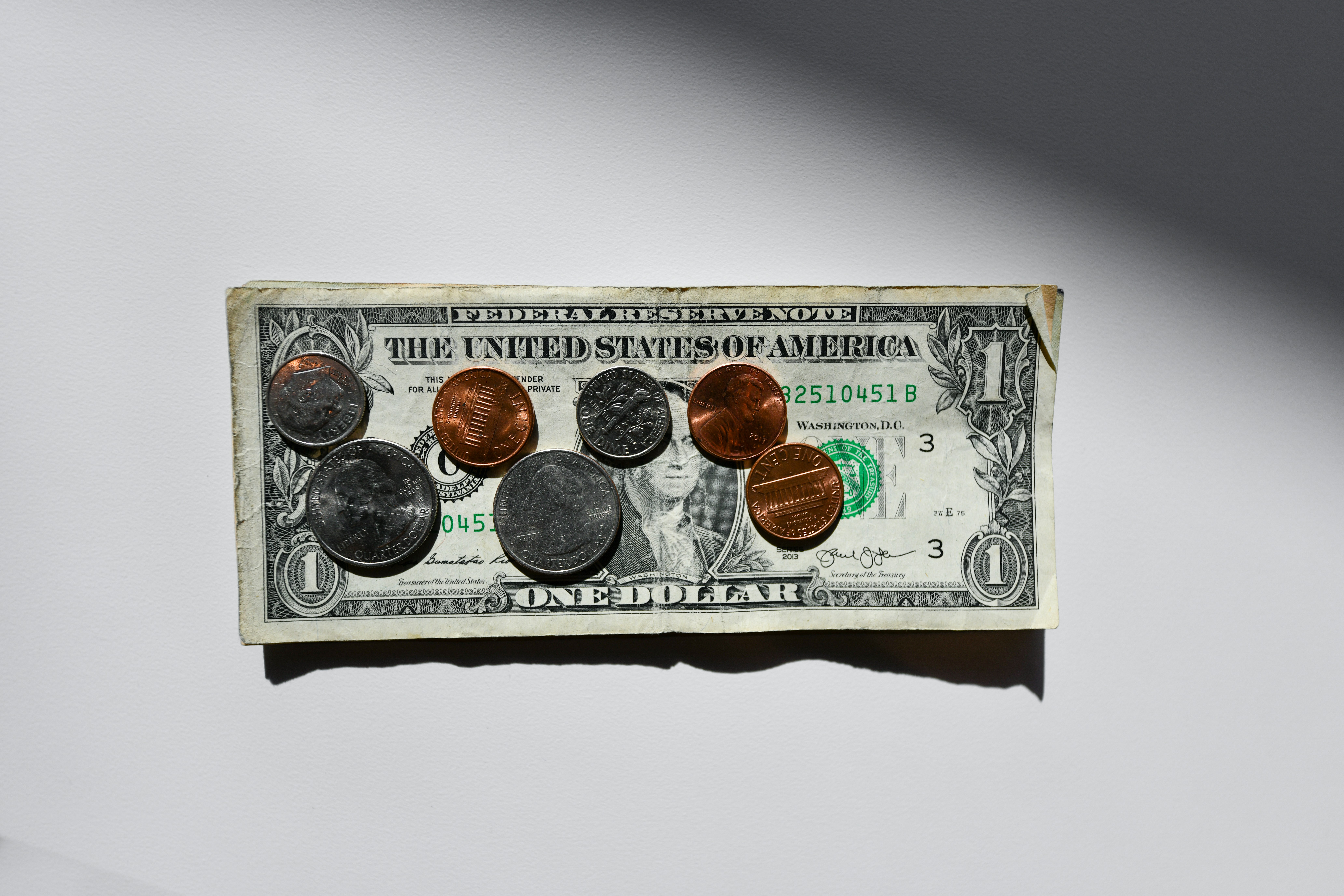 a dollar and change to emphasize trump tariffs